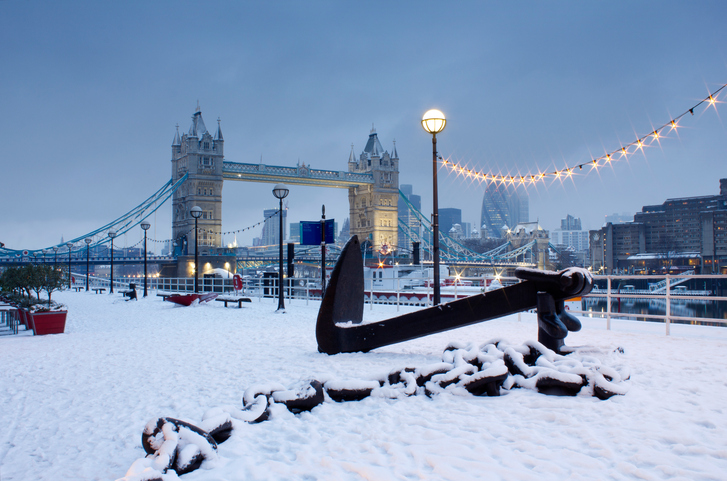 Early morning image of Tower bridge in snowfall.