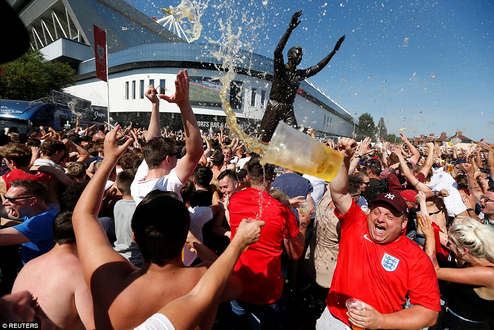 England fans in Bristol's Ashton Gate Stadium hurl beer in the air the moment Deli Alli scores England's second goal 