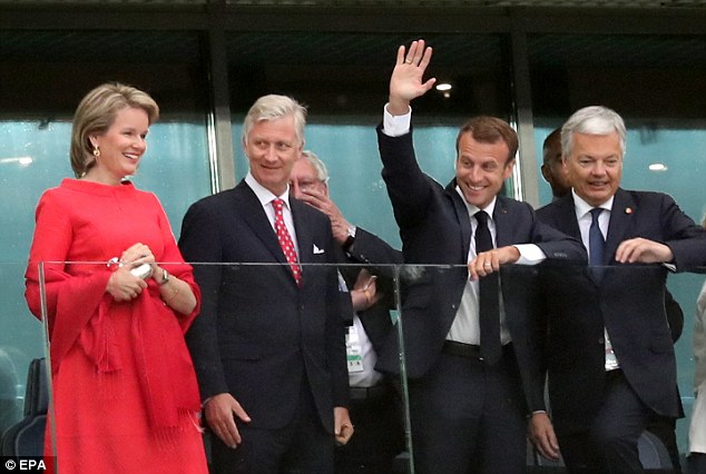 Belgium's Queen Mathilde and King Philippe, French President Emmanuel Macron and Belgian Foreign Minister Didier Reynders arrive for the semi-final