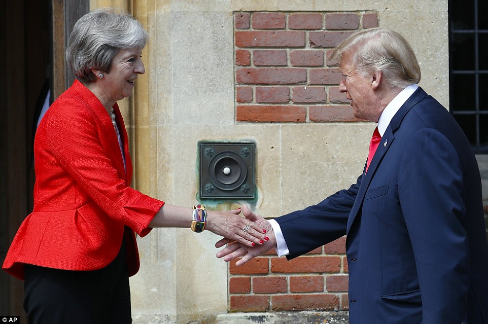 The two world leaders shook hands ahead of crunch talks as Mrs May had to swallow his criticism of her Brexit negotiations 